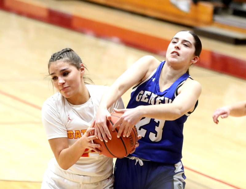 Batavia’s Hallie Crane (left) and Geneva’s Lucie Garnier battle for possession during the Class 4A Batavia Sectional final on Thursday, Feb. 22, 2024.