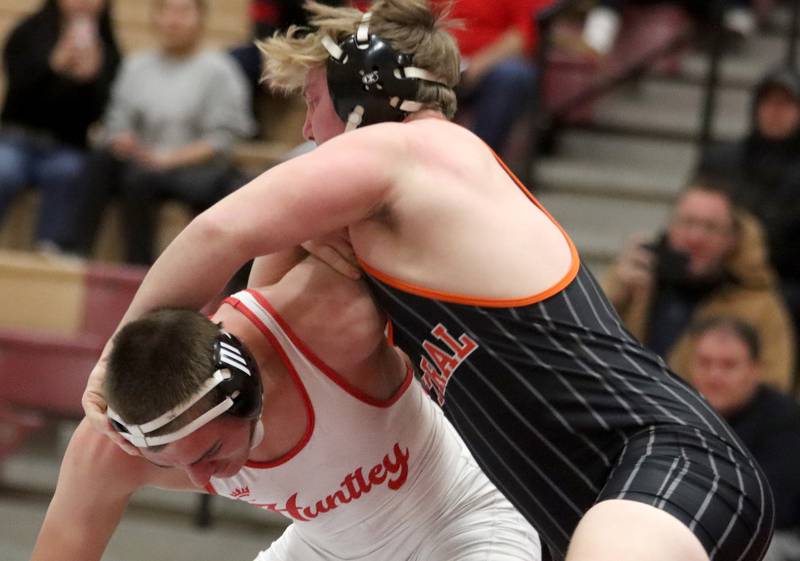 Huntley’s Wyatt Theobald, bottom, battles Crystal Lake Central’s Tommy McNeil at 215 pounds in varsity wrestling on Friday, Dec. 13, 2024 at Huntley High School in Huntley.