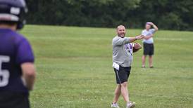 Principal as football coach? Dixon administration will be more visible on game days
