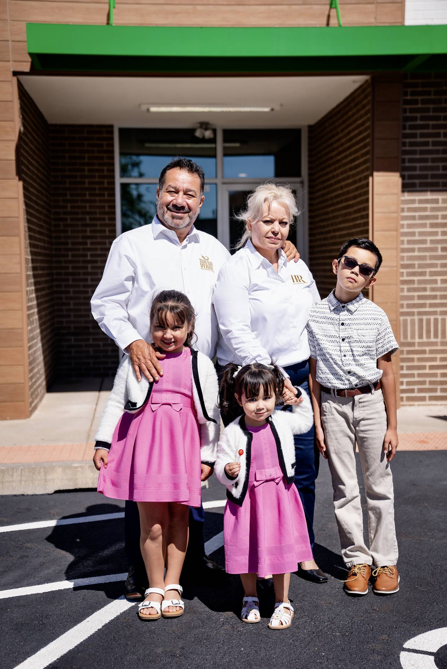 Salsa Verde owner Carlos Arechiga poses with his family outside the Yorkville location. Arechiga said the community embraced the Mexican restaurant's family-oriented way of business.