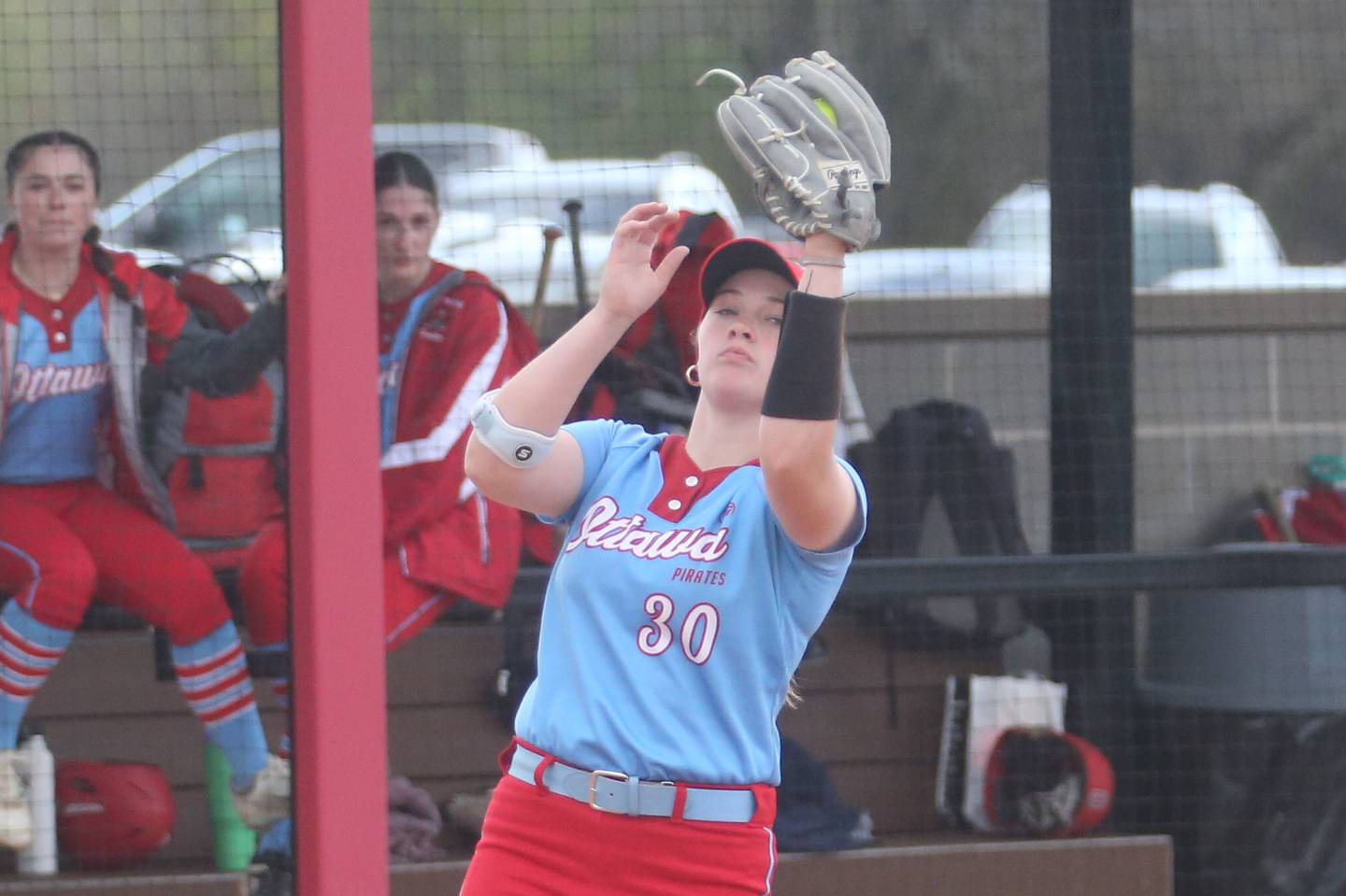 Ottawa third baseman Aubrey Sullivan squeezes the ball to make an out against L-P on Monday, April 21, 2025 at the L-P Athletic Complex in La Salle.