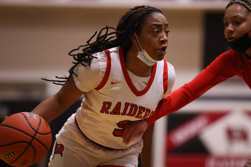 Bolingbrook’s Kennedi Perkins drives to the basket against Homewood-Flossmoor in the Class 4A Bolingbrook Sectional championship. Thursday, Feb. 24, 2022, in Bolingbrook.
