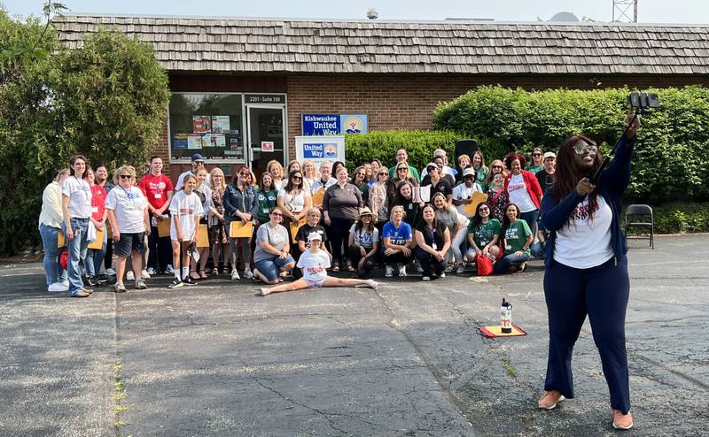 Angel Hannah, community outreach director for Kishwaukee United Way, takes a selfie with everyone who turned up for the 2023 Kishwaukee United Way annual Day of Caring event on June 15, 2023.