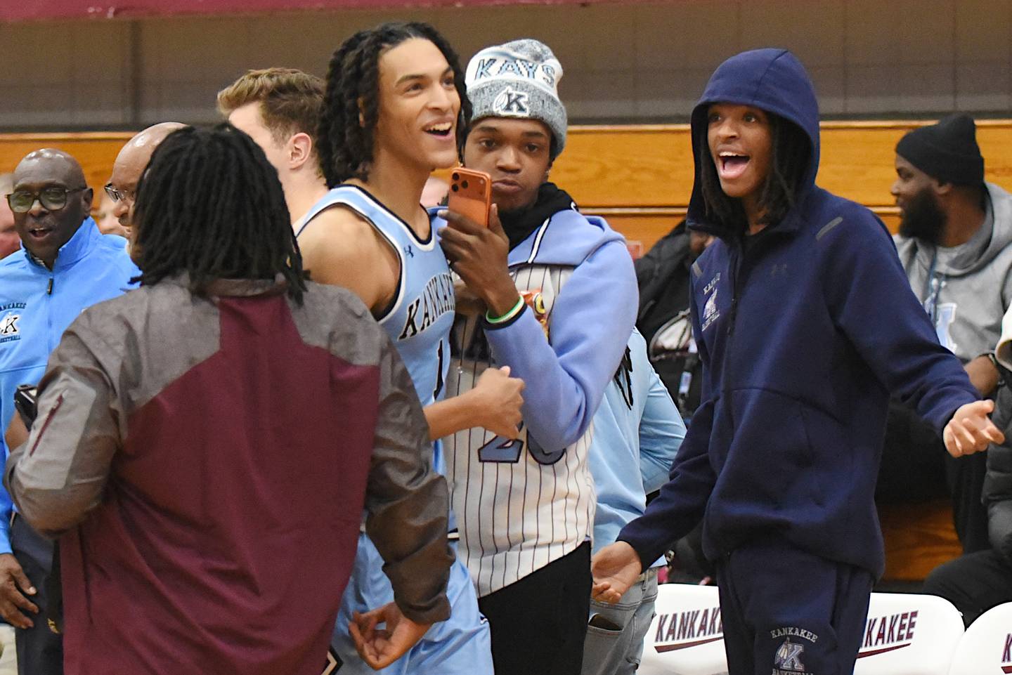 Kankakee's Lincoln Williams, second from left, smiles as he looks to the scoreboard to see his single-game school record 44 points in the Kays' home game against Thornridge Friday, Dec. 5, 2025.