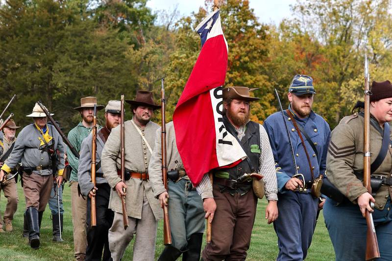 Soldiers march in a row during Shadows of the Blue and Gray event on Sunday, Oct. 13, 2024 at City County Park in Princeton.