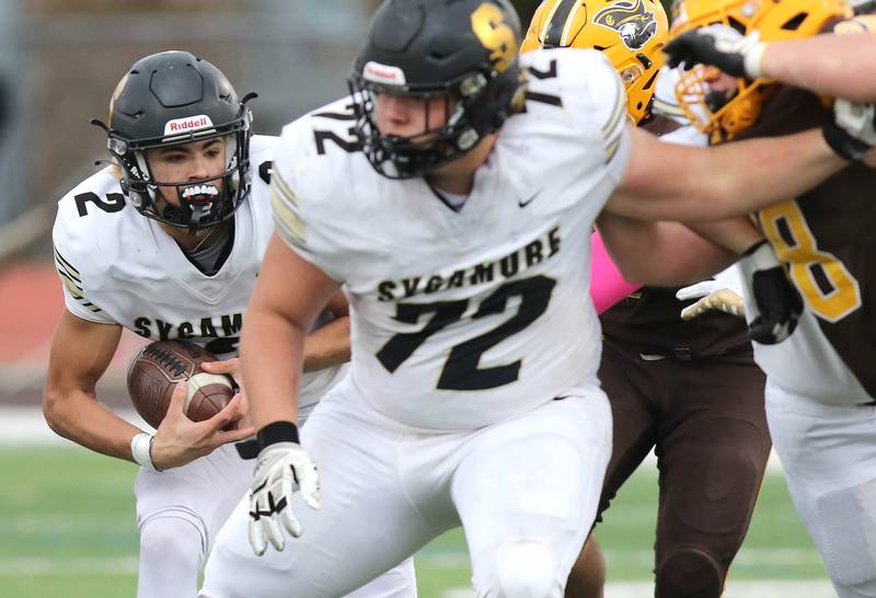 Sycamore's Elijah Meier follows the blocking of Lincoln Cooley through the Carmel line during their Class 5A second round playoff game Saturday, Nov. 5, 2022, at Carmel Catholic High School in Mundelein.