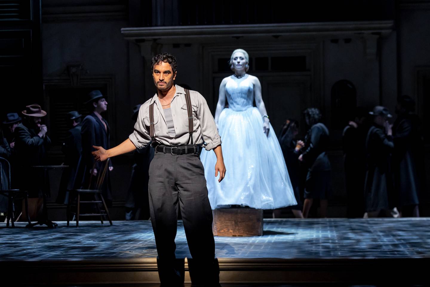 Richard Bermudez (Che) and Michelle Aravena (Eva) in an early scene from the musical "Evita," playing through March 20 at the Drury Lane Theatre in Oakbrook Terrace.