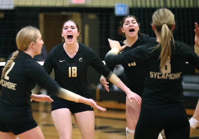 Sycamore players celebrate a point during their match against Kaneland Tuesday, Oct. 1, 2024, at Sycamore High School.