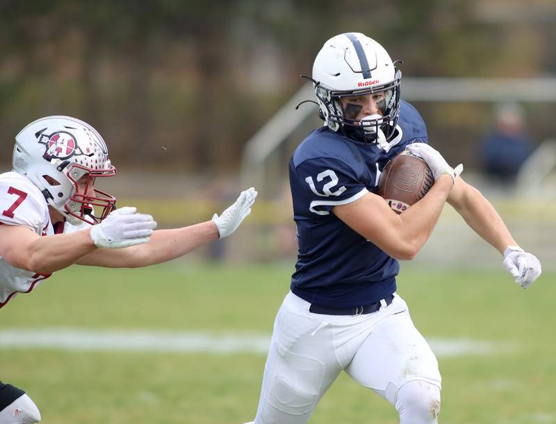 Cary-Grove’s Landon Barnett eludes Antioch’s Wyatt Ertl in IHSA Class 6A second-round playoff football action on Saturday, Nov. 9, 2024, at Al Bohrer Field on the campus of Cary-Grove High School in Cary..