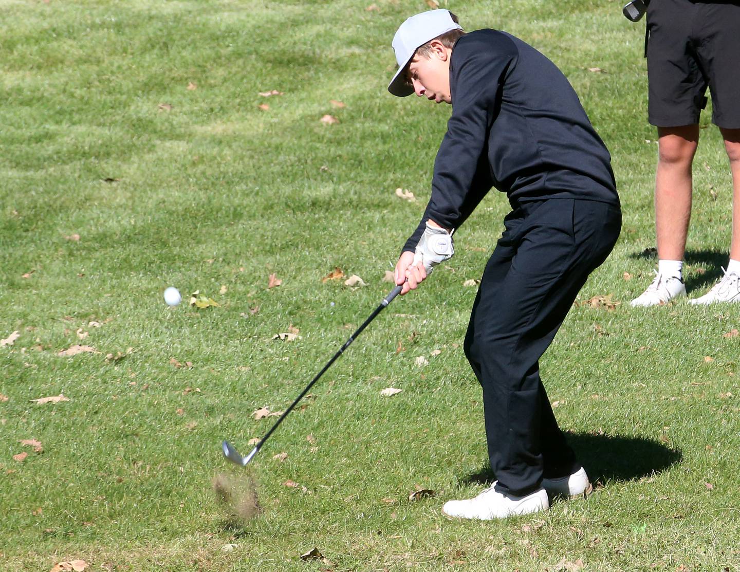 Mendota's Brody Hartt swings towards the 18th hole during the Class 2A Regional golf meet on Wednesday, Oct. 2, 2024 at Senica's Oak Ridge Golf Club in La Salle.