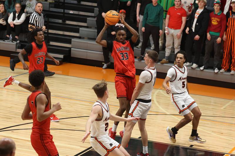 Bolingbrook’s Jeremy McCullum passes against Minooka on Tuesday, Dec. 17, 2024 in Minooka.