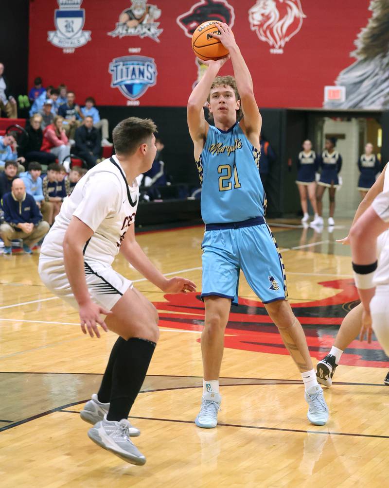 Marquette’s Lucas Craig shoots over Indian Creek's Payton Hueber Monday, Dec. 9, 2025, during their game at Indian Creek High School in Shabbona.