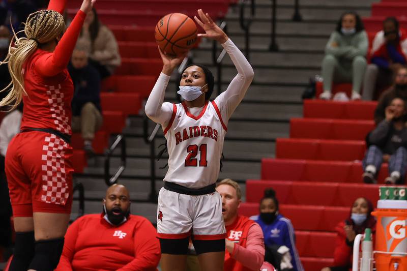 Bolingbrook’s Persais Williams puts up a three point shot against Homewood-Flossmoor in the Class 4A Bolingbrook Sectional championship. Thursday, Feb. 24, 2022, in Bolingbrook.