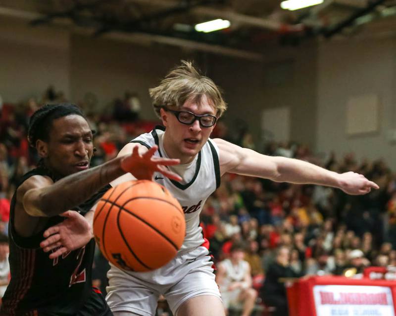 Yorkville's Alonn Flint (2) and Benet's Ryan Walsh (2) battle for a loose ball during their Class 4A Bolingbrook Sectional semifinal basketball game between Yorkville at Benet, March 3, 2026 in Bolingbrook.