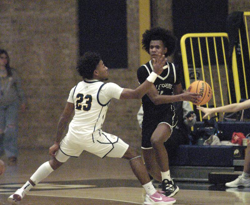 Sterling  Kaedon Philips blocks the path of Galesburg's Lesley Kelly. Sterling Boys Basketball hosted Galesburg at Musgrove Fieldhouse on February 11, 2025.