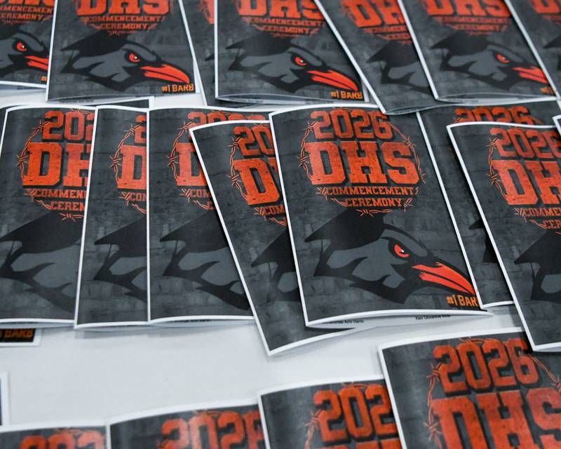 Programs are laid out before the start of the DeKalb High School graduation ceremony on Saturday May 23, 2026, held at the Convocation Center in DeKalb.