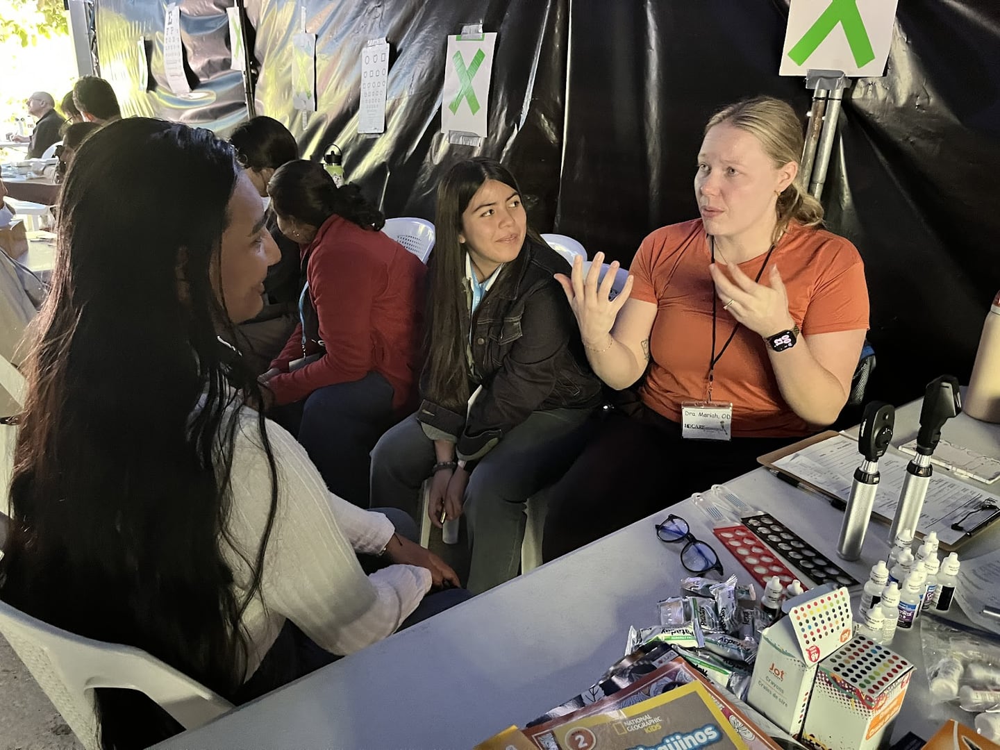 A volunteer with I Care International talks with a Guatemalan during their most recent visit to the country.
