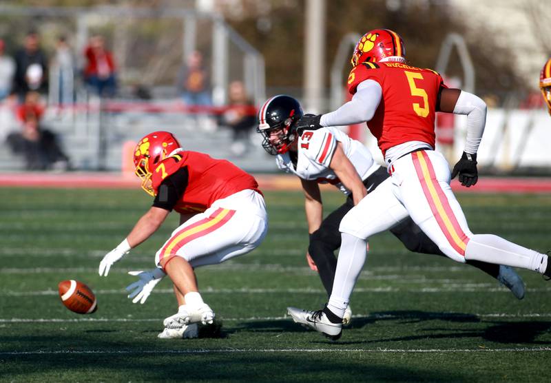 Batavia’s RJ Bohr (left) and Jordan Buckley go after a loose ball during the Class 7A second round playoff game against Lincoln-Way Central in Batavia on Saturday, Nov. 4, 2023.