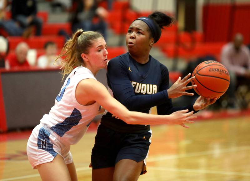 Neuqua Valley’s Caitlin Washington (right) is guarded by Nazareth’s June Foley during a game at Hinsdale Central on Thursday, Nov. 16, 2023.