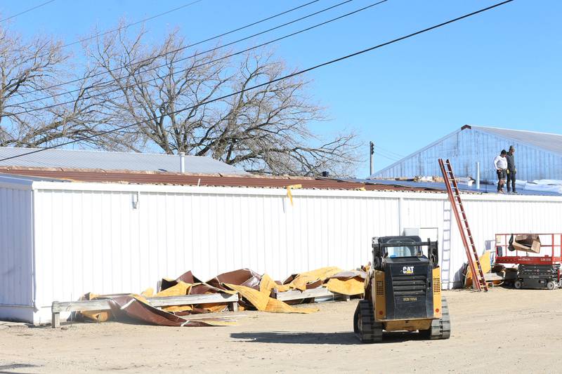 Crews from Vitale Construction work on replacing the roof of the exterior of the Exhibit Hall's 1 and 2 building on Wednesday, Nov. 8, 2023 at the Bureau County Fairgrounds in Princeton.