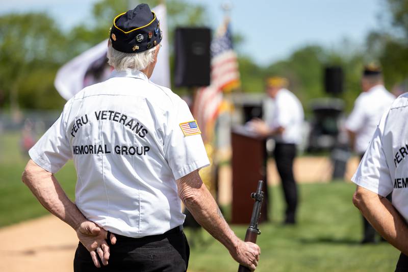 Lanny Slevin of the Peru Honor Guard watches speech on Monday, May 26, 2025 at Washington Park in Peru.