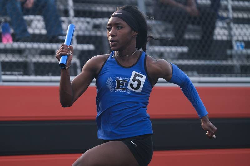 Lincoln-Way East’s anchor Mariam Azeez breaks away to win the 4x100 meter relay at the Class 3A Minooka Girls Sectionals. Wednesday, May 11, 2022, in Minooka.