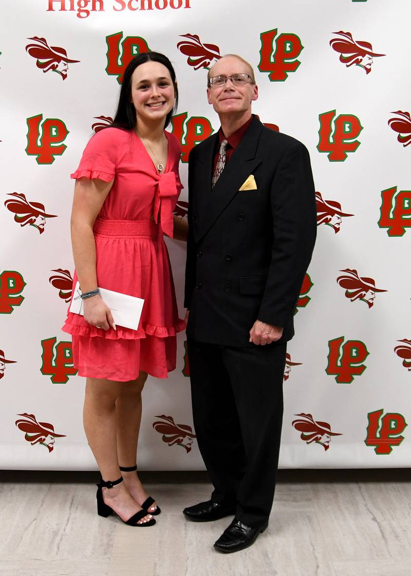 Cora Hollaway (left) received the Ficek-Carboni Heritage Scholarship from Bill Carboni (right). The $1,000 scholarship is awarded to a student with a cumulative GPA of at least 2.4 who plans to attend college and submitted an essay.