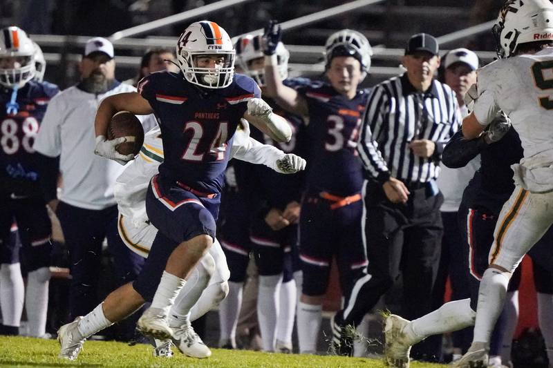 Oswego’s Ayden Villa (24) carries the ball against Waubonsie Valley during a Class 8A first-round playoff game at Oswego High School on Friday, Nov. 1, 2024.