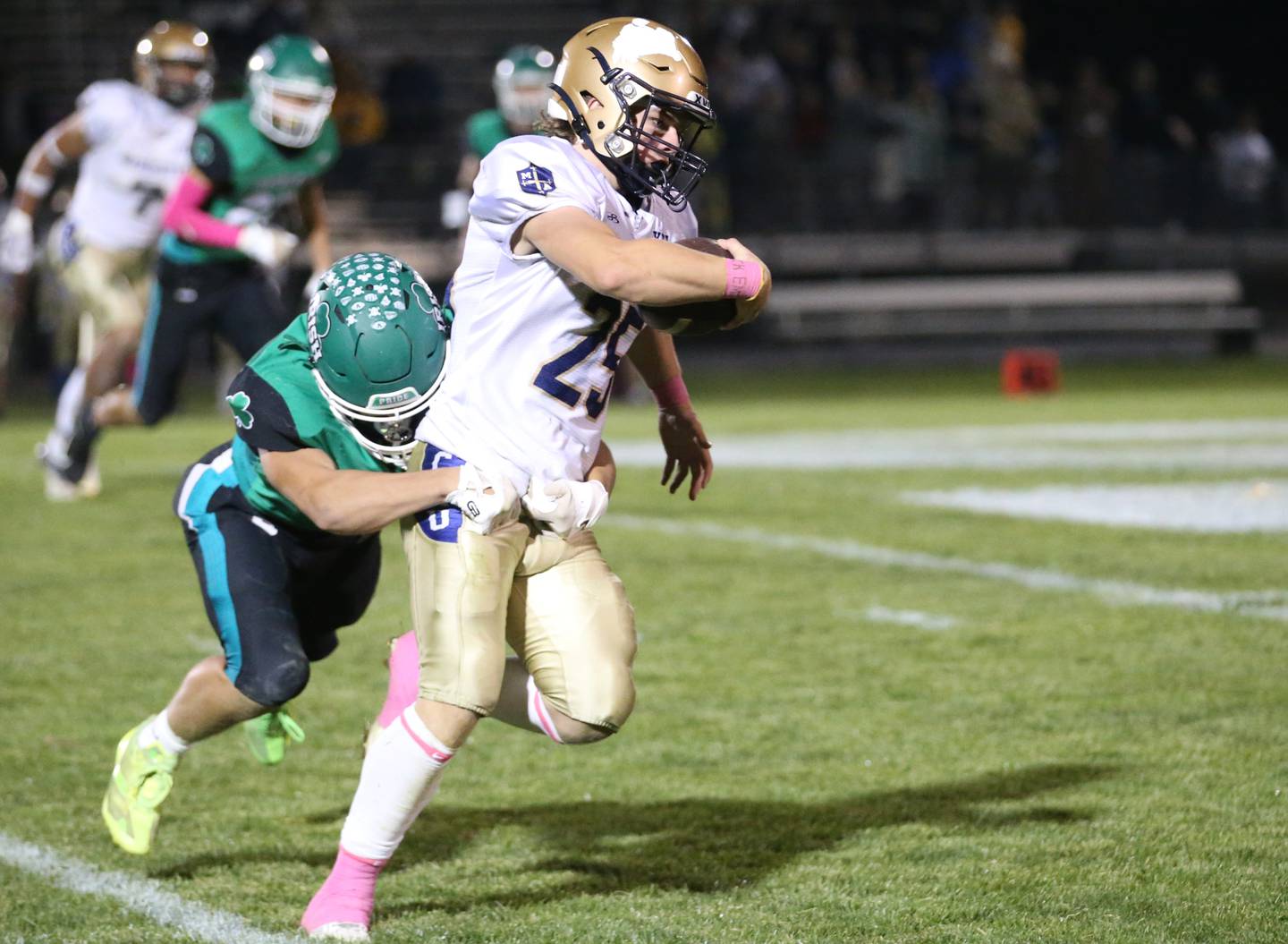 Seneca's Gunner Varland tries to wrap up Marquette ballcarrier Jaxsen Higgins on Friday, Oct. 18, 2024, at Seneca High School.