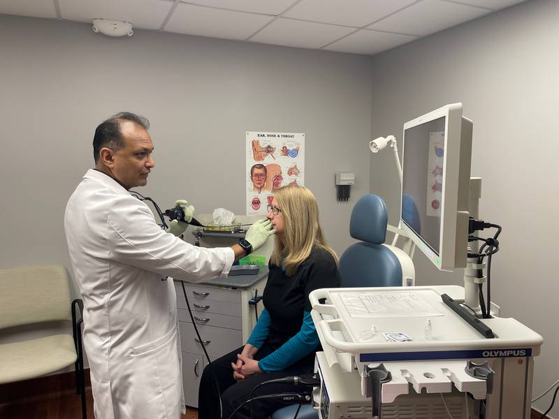 KSB Ear, Nose and Throat Specialist Dr. Fazlur Zahurullah demonstrates the use of new imaging equipment to office nursing staff.