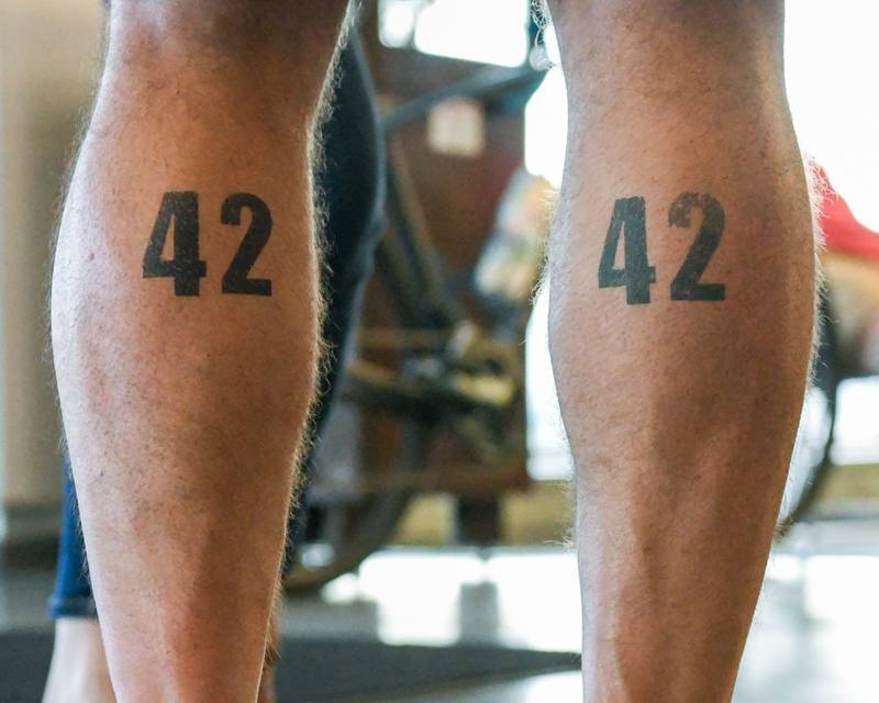 DeKalb County Sheriff Andy Sullivan has the number 42 tattooed on his calfs from falling DeKalb County Sheriff officer Christina Musil who lost her life in the line of duty on March 29, 2024, as Andy took at break on Saturday July 12, 2025, at Northern Illinois university’s Stevenson Towers during the Cycle Across Illinois.