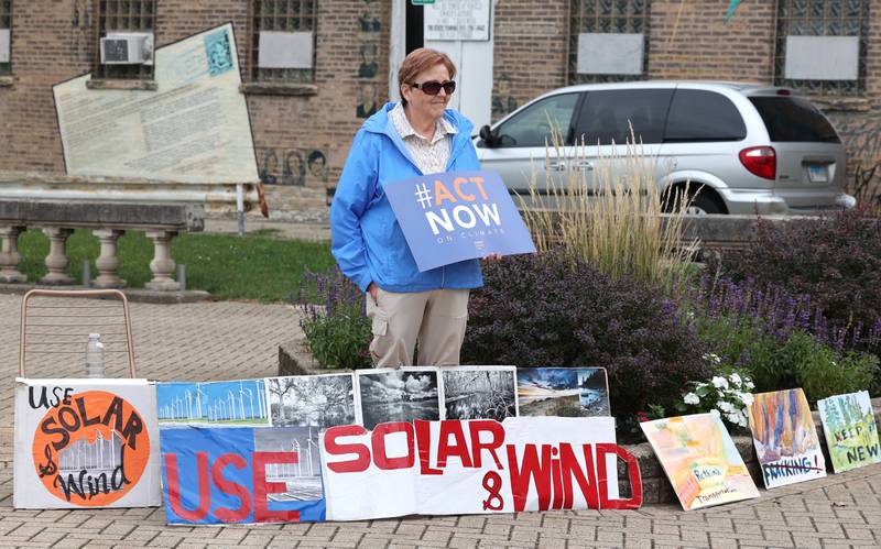 One of the people who gathered for a rally Saturday, Sept. 16, 2023, at Memorial Park in downtown DeKalb. The demonstration was held to push legislators to promote alternative forms of energy and lessen the use of fossil fuels.