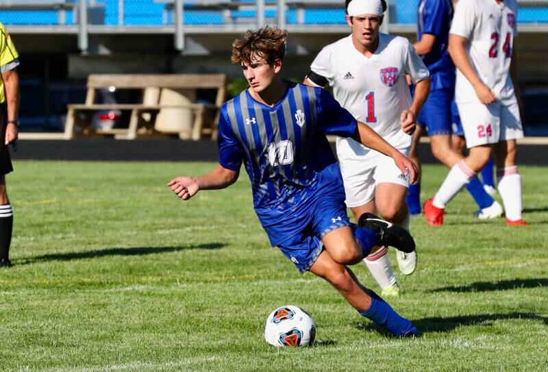 Princeton senior Matthew Sims pushes the ball up Monday against Streator.