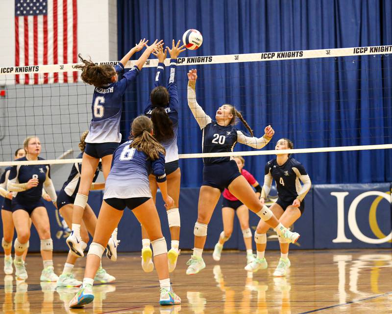 IC Catholic Prep's Emily Carling (20) tips the ball over the net during volleyball match between Nazareth at IC Catholic Prep.  Aug 29, 2023.