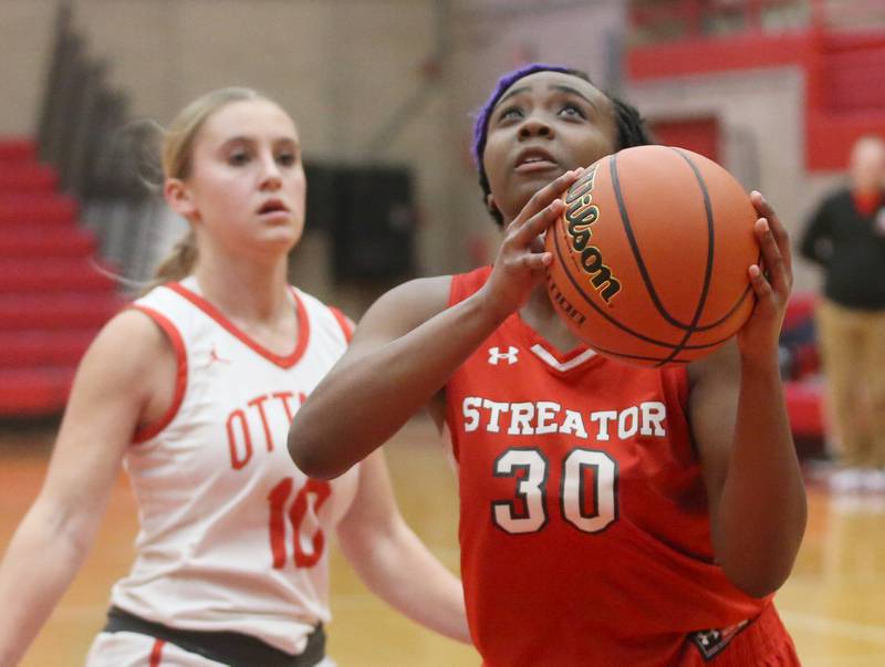 Streator's Shantell Morton eyes the hoop after running past Ottawa's Ella Schmitz during the Lady Pirate Holiday Tournament on Wednesday, Dec. 20, 2023 in Kingman Gym.