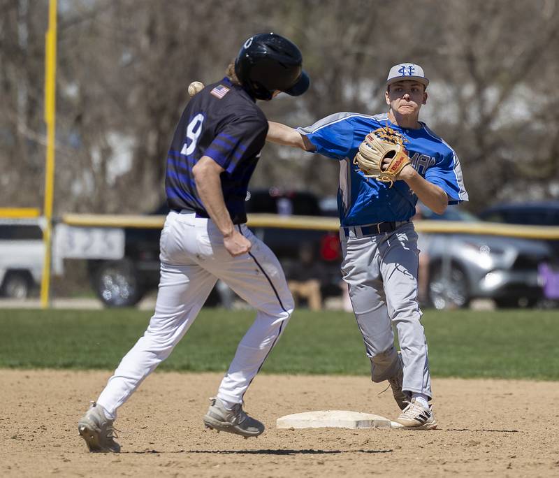 Newman’s Chase Decker fires to first to complete a 5-4-3 double play against Dixon Saturday, April 13, 2024 at Veterans Memorial Park in Dixon.