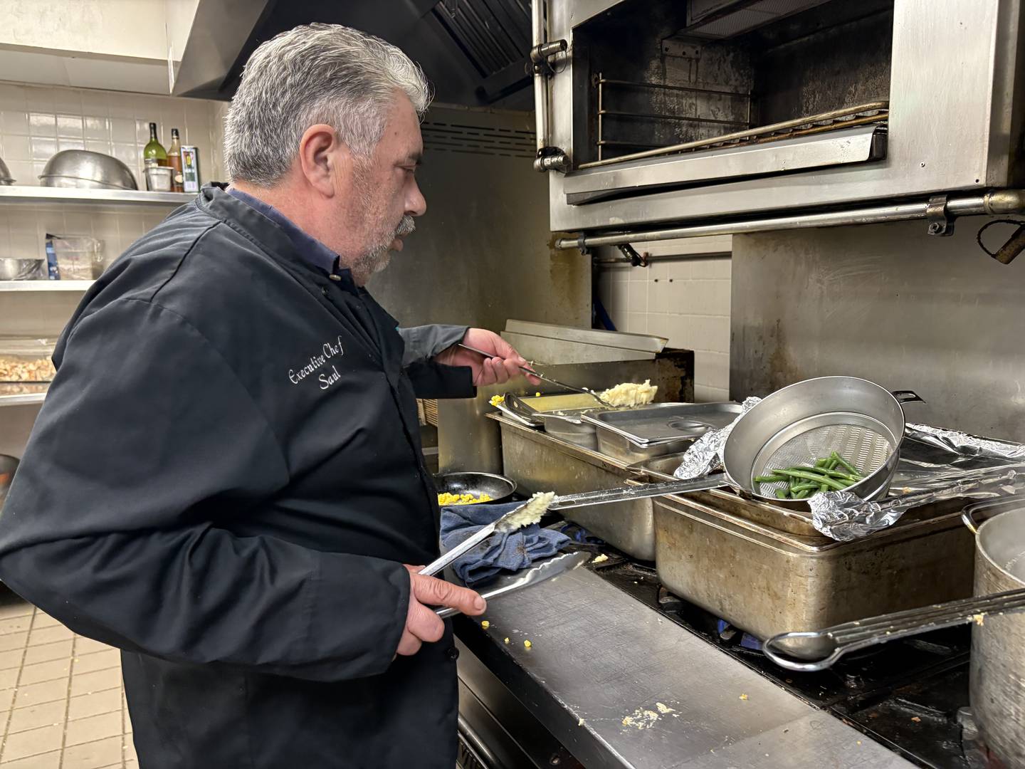 Saul Suarez, executive chef at The Metalwood Grille in McHenry, makes Thanksgiving dinners on  Nov. 28, 2024 to be delivered by volunteers to seniors.