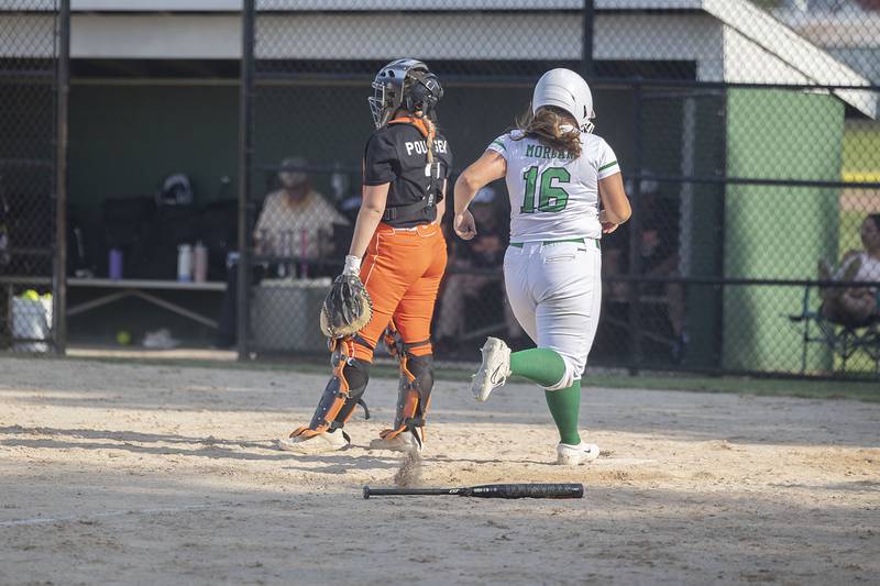 Rock Falls’ Zoe Morgan comes in to score to put the four inning merct rule into affect Tuesday, May 16, 2023 against Byron.