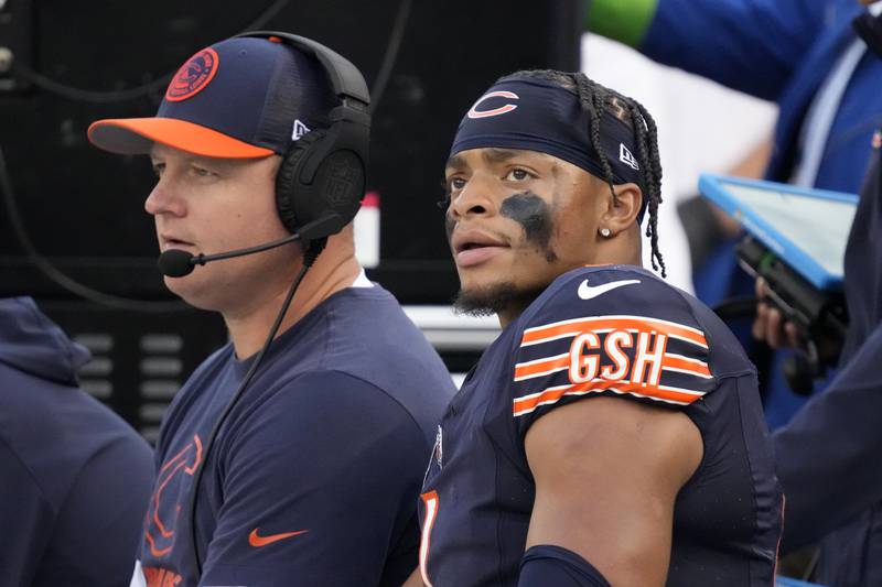 Chicago Bears quarterback Justin Fields sits on the bench with offensive coordinator Luke Getsy during the second half, Sunday, Sept. 10, 2023, against the Green Bay Packers in Chicago.