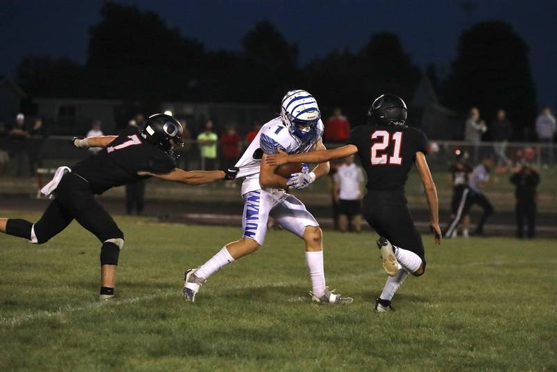 Orion tried everything the could to tr to slow down Princeton sophomore back Casey Etheridge Friday night. He scored five touchdowns in the Tigers' 42-0 win.