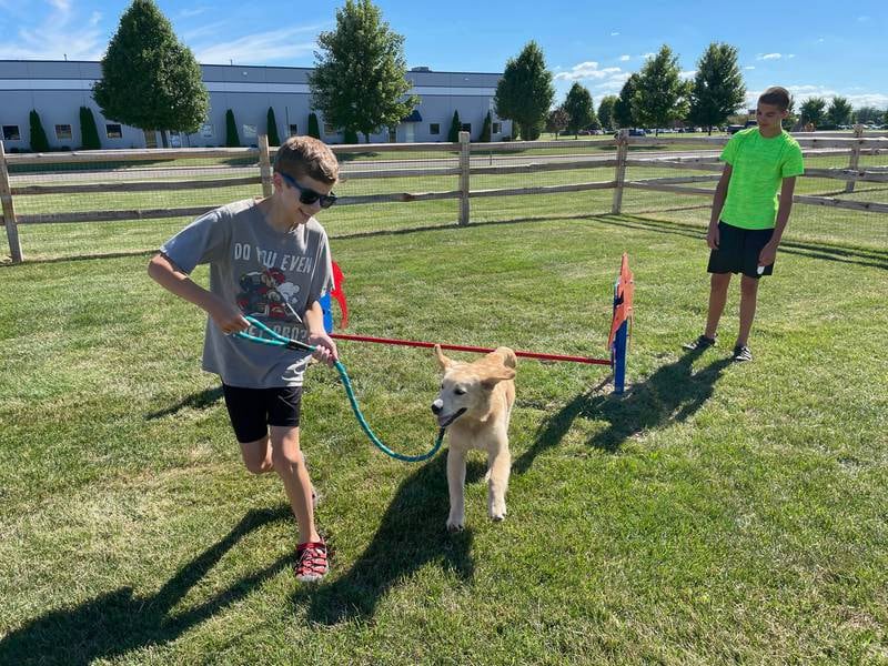Dogs and their people enjoyed Oswego's new Happy Tails dog park on its first day of operation on Tuesday, Aug. 9, 2022.