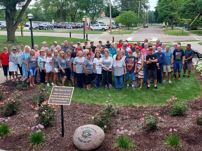 Members of the Ottawa High Class of 1971 at the OTHS “O” in front of the Passageway. The area was dedicated to Ottawa High from the Class of 1971 last summer. The Class of 1971 celebrated its 
50 + 1 Reunion celebration July 21-23 with the theme “Flashback to the 70s.”