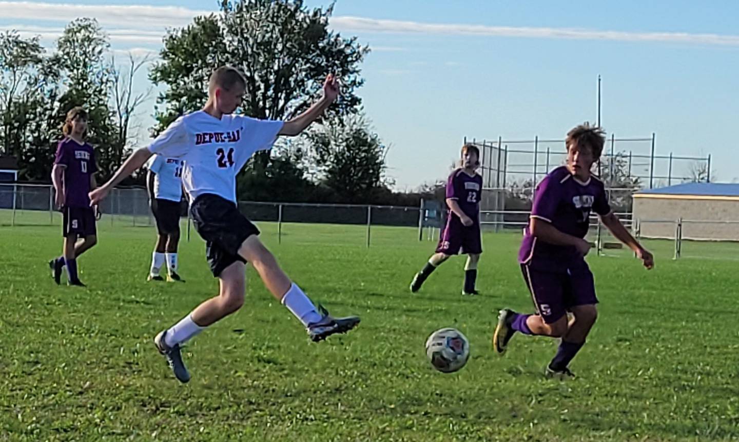 DePue-Hall's Nathan Harrison kicks the past Serena's Mason McNelis during Thursday's Class 1A boys soccer regional semifinal at Serena High School. The Huskers advanced with a 2-1 win over the Little Giants.