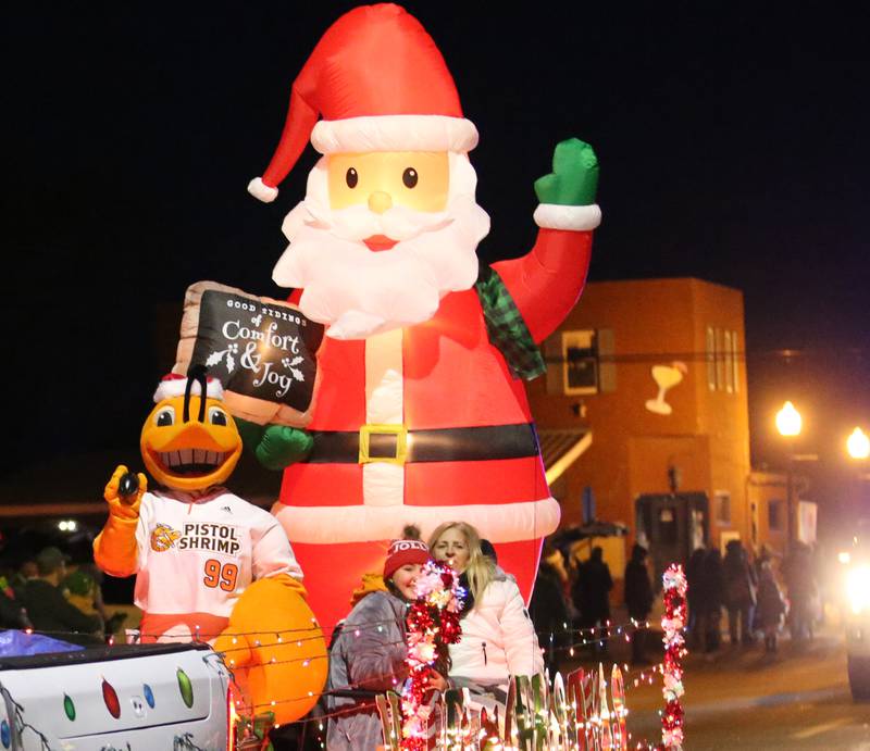 The Illinois Valley Pistol Shrimp float makes it's way down Peoria Street in the Light uThe Illinois Valley Pistol Shrimp float makes it's way down Peoria Street in the Light up the Night parade on Saturday, Dec. 3, 2022 downtown Peru. p the Night parade on Saturday, Dec. 3, 2022 downtown Peru.