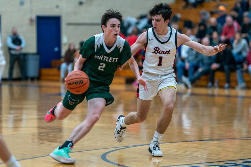 Bartlett's Kelton McEwen (2) drives to the basket against Benet’s Sam Driscoll (1) during the 4A Addison Trail Regional final at Addison Trail High School in Addison on Friday, Feb 24, 2023.