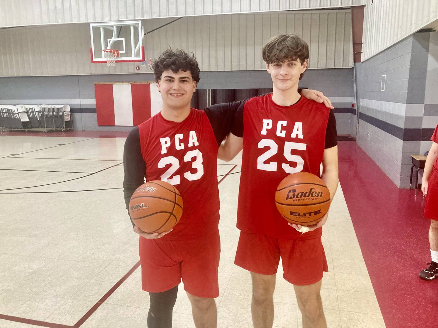 Aaron Dixon (left) and Coltyn Buck were recognized on Senior Night at Princeton Christian Academy on Tuesday. PCA is playing its first year of high school basketball.