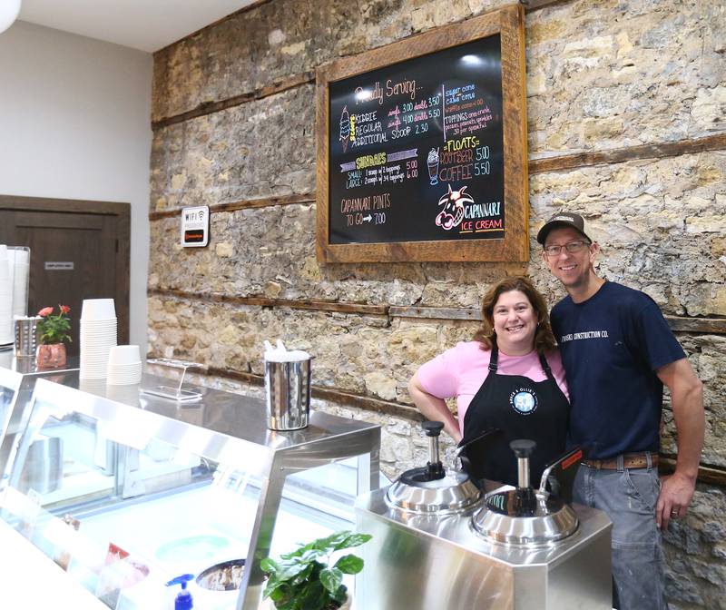 Owners Jen and Matt Cetwinski, pose behind the ice cream counter at The Bickerman building downtown Utica on Thursday May 13, 2021. the Cetwinski family bought the building last November and renovated it into a ice cream, coffee and sandwich shop. built in 1874, the Bickerman Building has housed many businesses over the years. The village’s first post office occupied the building when it first opened. Clark’s Hall and Cary Theatre also were located in the historic structure.
The building was left vacant from 1946-56 and, after it was bought by the Bickermans, Frances Bickerman embarked on a major building rehabilitation, including the installation of an elevator in the building to maneuver easily between floors. The elevator still exists. Most people, however, will remember the building as Bickerman’s Hardware from 1956-93 – Carey’s Barber Shop, a boutique, photography studio and a retail store.