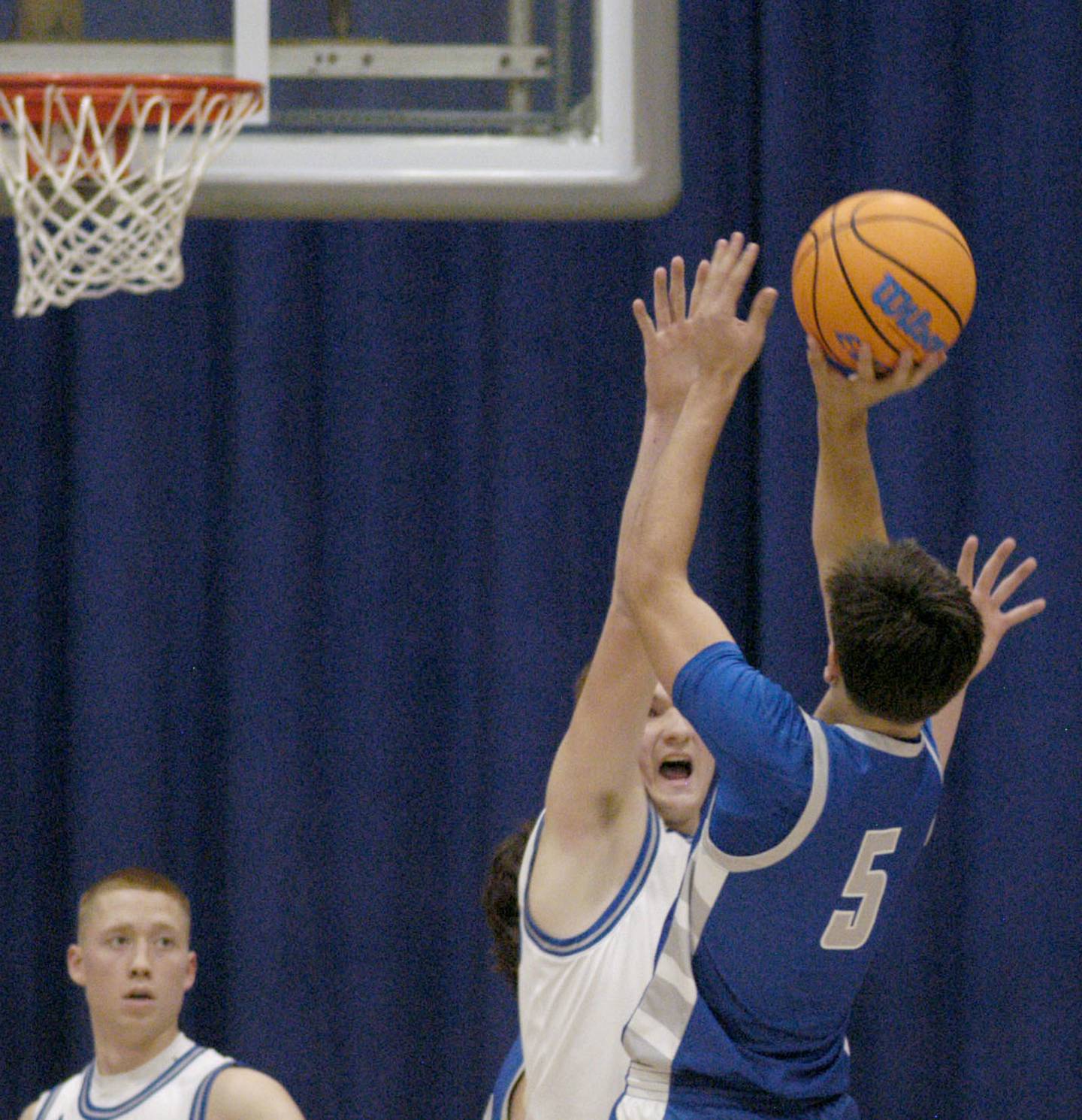 Princeton's Jack Oester goes for a shot over a Newman defender. 1-3 Princeton played Newman (3-0) in a conference game. The matchup took place at Newman High School on Friday, December 5, 2025.