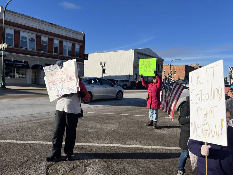 Lynn Batalden (left) and Joan Holeman (right) hold up signs in support of women's rights on Saturday, Jan. 18, 2025, while standing in parking spots along State Street in downtown Sycamore. Organizers held a DeKalb County rally the same day as a national women's march in Washington, D.C., days before Donald Trump's second presidential inauguration.