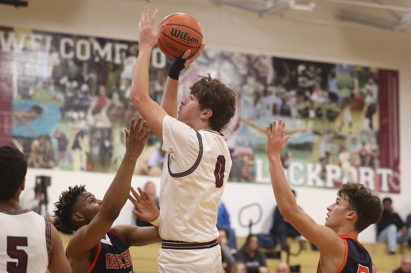 Lockport’s Hyatt Timosciek puts up a shot against Oswego.